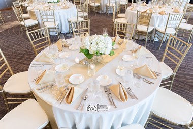 Beautiful Wedding Guest Table Setting With White Roses and Hydrangeas - The Hotel at Oberlin