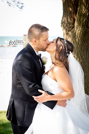 Bride and Groom Kiss Near a Tree After Wedding Ceremony - Ohio Weddings, The Hotel at Oberlin