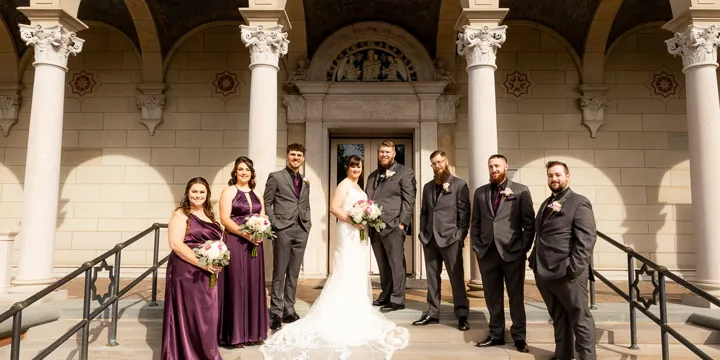 Bride, Groom, and Bridal party on stairs wide