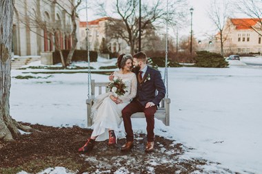Bride and Groom on Swinging Bench in Snow - Ohio Winter Wedding