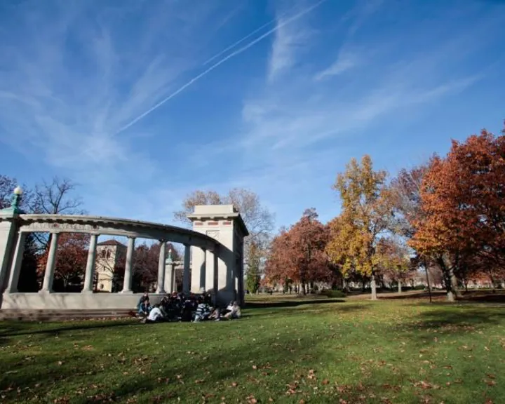 Students sitting outside the Memorial Arch at Oberlin College